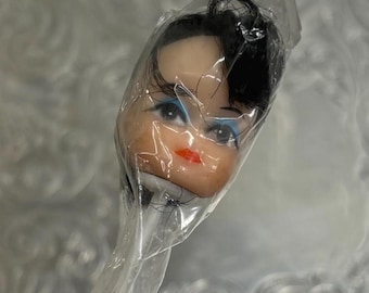 Vintage Rubber Doll Head Pick on Wire. Craft Supplies. NOS