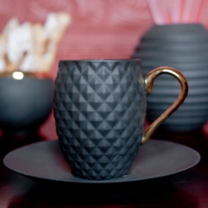 Small Black Textured Coffee Cup with Gold Handle