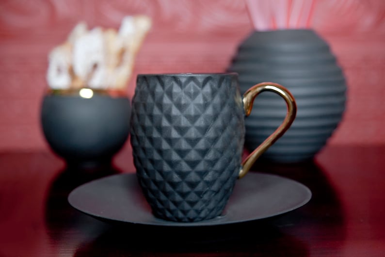 Small Black Textured Coffee Cup with Gold Handle