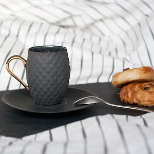Small Black Textured Coffee Cup with Gold Handle
