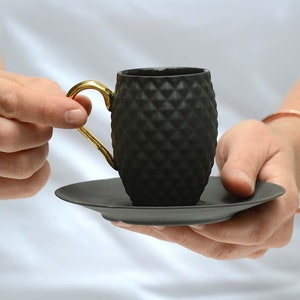 Small Black Textured Coffee Cup with Gold Handle