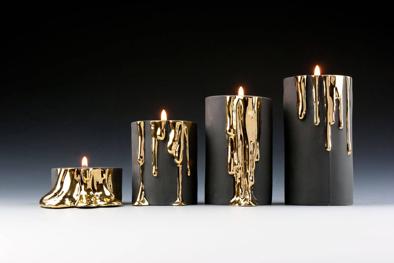 Black and gold candle holders deals