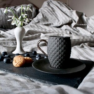 Small Black Textured Coffee Cup with Silver Handle