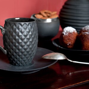 Small Black Textured Coffee Cup with Silver Handle
