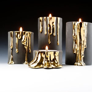 Black and Gold Candle Holders With Dripping Wax