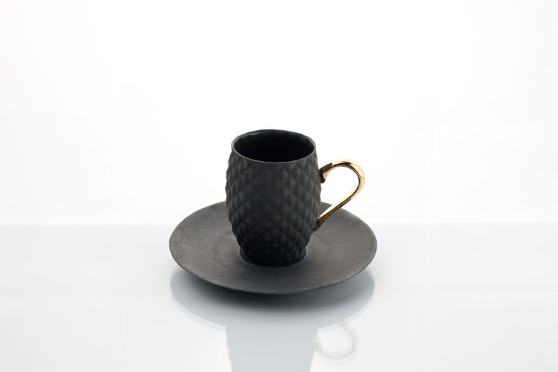 Small Black Textured Coffee Cup with Gold Handle