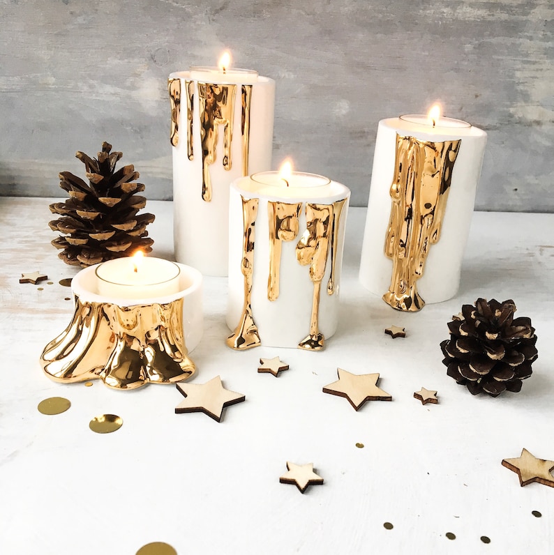 White and Gold Candle Holders With Dripping Wax