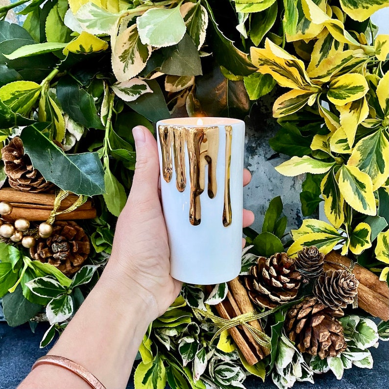 White and Gold Candle Holders With Dripping Wax