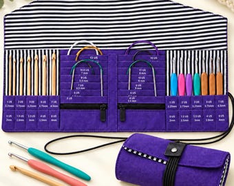 May include: A purple fabric organizer case with a black and white striped interior, containing various crochet hooks and circular knitting needles. The case features labeled slots for sizes ranging from 0 US (2mm) to 15 US (10mm) and includes three loose hooks.