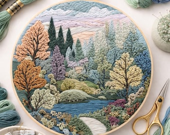 May include: A detailed embroidery hoop art piece depicting a serene landscape with trees, a river, and a path. The artwork features various colors, including greens, blues, and browns. The embroidery is set in a wooden hoop, with spools of thread and gold scissors nearby.