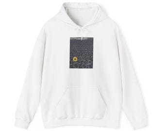 May include: White hoodie with a front pocket and drawstring hood. The image on the front features a field of sunflowers, with one sunflower in full color and the rest in grayscale.