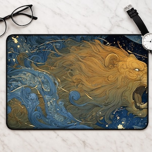May include: A rectangular desk mat featuring a detailed illustration of a roaring lion with a golden mane, set against a backdrop of swirling blue waves and scattered yellow stars. The artwork uses intricate line work to blend the lion with water.