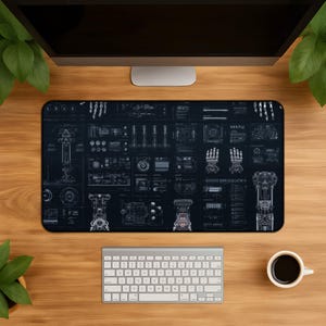 May include: A rectangular desk mat featuring a dark blue background with white technical schematics and blueprints of robotic components, including mechanical hands, joints, and various engineering diagrams arranged in a grid-like layout.