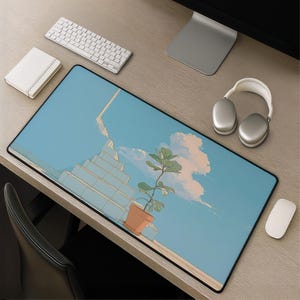 May include: A rectangular desk mat featuring a light blue sky background with white and pinkish clouds, a set of light blue stairs leading upward, and a green potted plant in a terracotta-colored pot placed on a wooden surface.