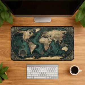 May include: A rectangular desk mat featuring a detailed world map in shades of dark teal and antique gold. The design includes intricate decorative borders, compass roses, and vintage-style cartographic elements across the entire surface area.