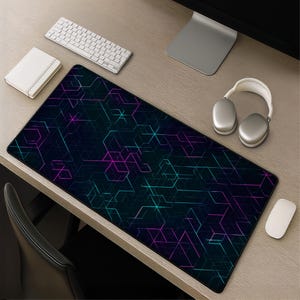 May include: A large rectangular desk mat featuring a dark black background with a geometric pattern of interconnected lines in vibrant neon cyan and magenta. The mat has a smooth surface and black stitched edges, providing a wide workspace area.