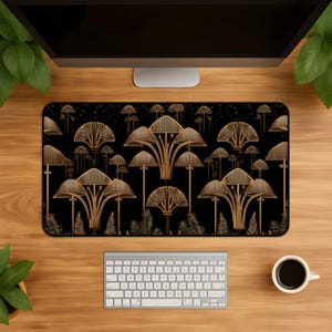 May include: A rectangular desk mat featuring a black background with a repeating pattern of stylized, golden-brown mushrooms and delicate fern-like foliage. The design showcases various mushroom shapes with linear, fan-like caps and thin stems.