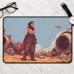 May include: A rectangular desk mat featuring a digital illustration of a character standing in a desert landscape amidst wreckage. The character wears a cream-colored top, dark brown trousers, and a flowing red scarf. Large mechanical debris surrounds them.