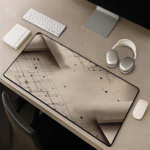 May include: A large rectangular desk mat featuring a beige and brown technical blueprint design with black lines, dots, and geometric patterns. The mat has a smooth surface and a thin black border, providing a wide workspace for computer accessories.