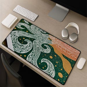 May include: A rectangular desk mat featuring a graphic design with swirling white lines on a dark green background, accented by scattered yellow circles and a textured orange section on the right side, all bordered by a thin black edge.