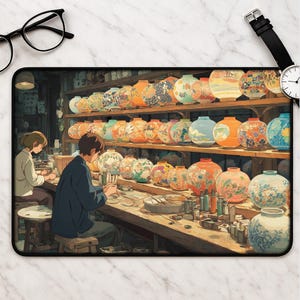 May include: Mousepad featuring an illustration of a workshop with artisans crafting colorful, patterned ceramic jars. The scene includes shelves filled with finished jars and two people working at a table, creating a detailed and artistic aesthetic.