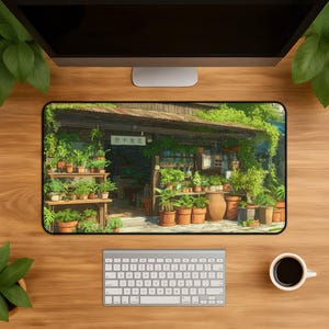 May include: A rectangular desk mat featuring an illustration of a small shop exterior filled with numerous potted green plants. The shop has a wooden structure, a dark roof, and a sign with Japanese text. Various terracotta pots sit on shelves.
