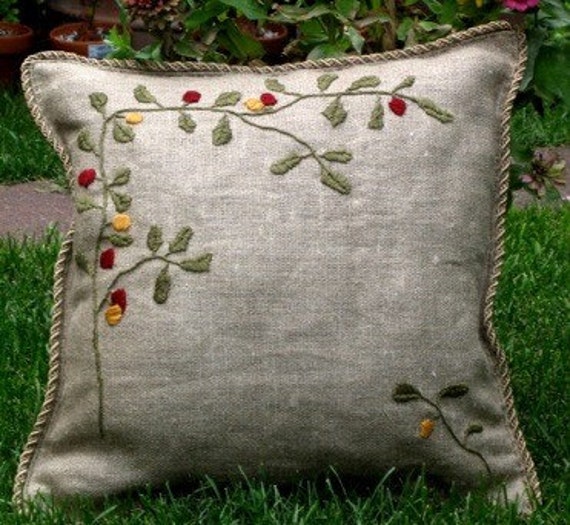 Items similar to hand embroidered pillow 18" ( coral, olives, tassels