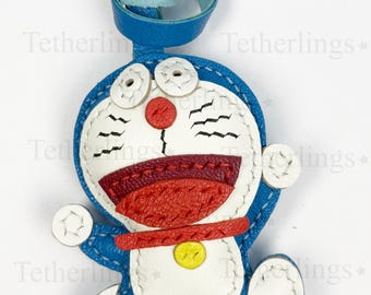 Colgante de cuero cosido a mano de Doraemon corriendo para bolso, accesorio para bolso de gato robot de dibujos animados