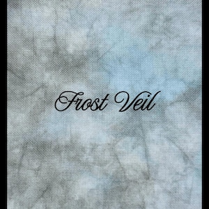 May include: A piece of fabric with a mottled, tie-dye style pattern in shades of grey, white, and pale blue. The texture of the woven material is clearly visible throughout the surface. The text "Frost Veil" is printed in black script in the center.