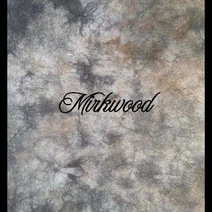 May include: A piece of fabric featuring a mottled tie-dye pattern in shades of charcoal gray, slate, and muted brown. The word Mirkwood is printed in a black, cursive script across the center of the textured, woven textile surface.