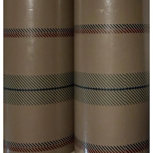 May include: Two cylindrical rolls of light brown paper featuring a repeating pattern of horizontal bands. Each band consists of thin, diagonal black lines paired with a single solid horizontal stripe in either dark red or deep navy blue.