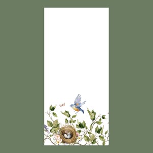 May include: A watercolor illustration of a bluebird flying over a nest with three eggs in a bed of green leaves and white flowers.
