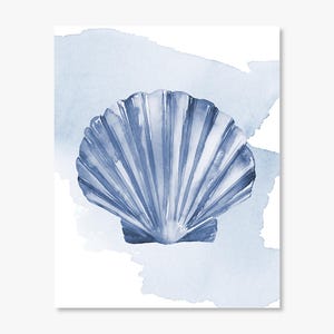 May include: Watercolor painting of a blue seashell on a white background with blue watercolor washes. The seashell is detailed with vertical lines and a textured appearance. The artwork evokes a coastal or nautical theme.