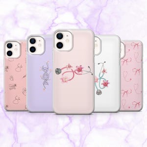 May include: Five phone cases with clear edges, each displaying a unique design. The cases showcase medical-themed illustrations, including a stethoscope with pink flowers, a DNA strand, and other medical symbols in pink and white. The cases are aligned.