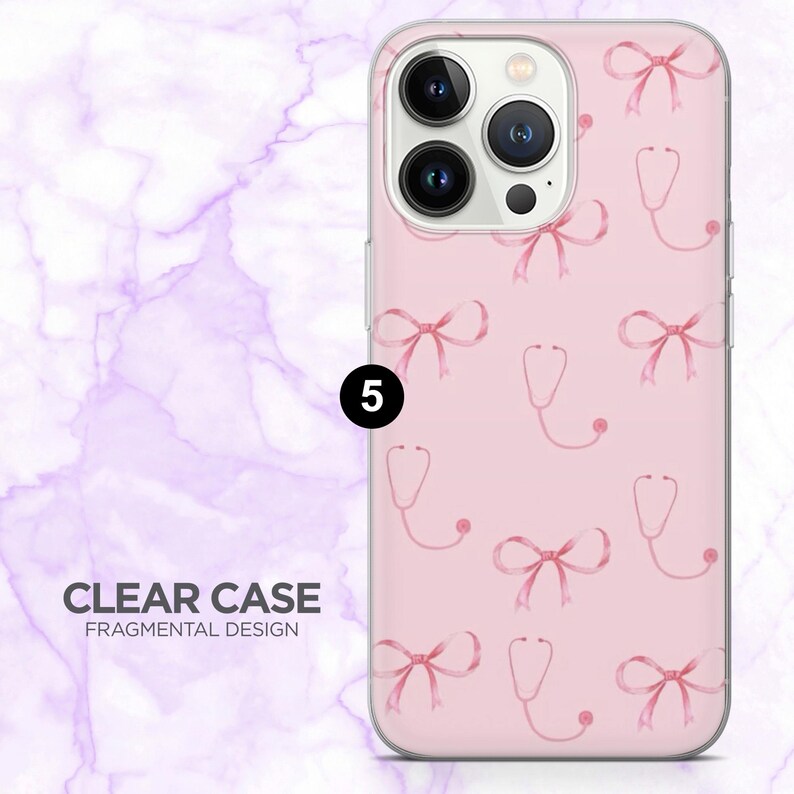 May include: A clear phone case with a pink background featuring a pattern of pink bows and stethoscopes. The case has a Fragmental Design and the text "CLEAR CASE" is visible.