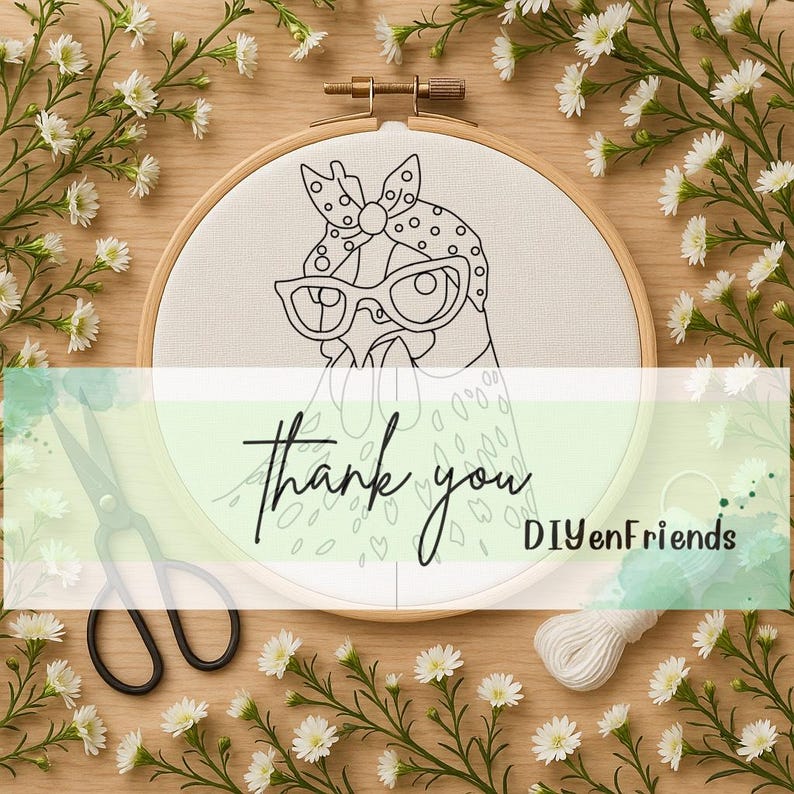 May include: A wooden embroidery hoop containing white fabric with a black line art illustration of a chicken wearing a polka dot headscarf and glasses. The text "Thank you" and "DIYenFriends" is printed across the center of the image.