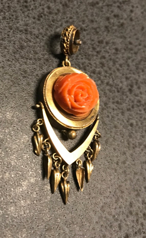 A victorian gold deeply carved genuine coral rose 