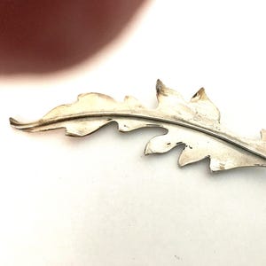 A large hand made vintage sterling silver leaf pin brooch.  Beautifully executed metal design and construction-