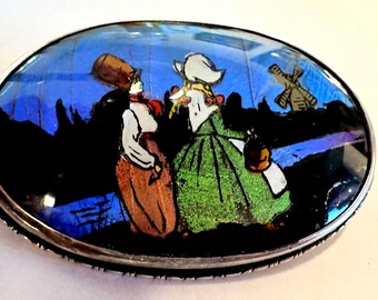 Sterling Brooch Butterfly wing backing shimmering painting of Dutch couple circa 1920s