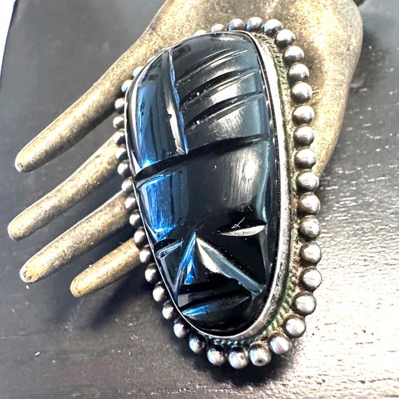 Brooch Sterling Carved Obsidian Aztec God face hand fabricated circa 1950s Mexican artist creation