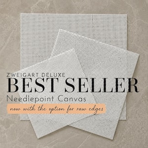 May include: Three square pieces of white Zweigart Deluxe needlepoint canvas with a grid pattern. The text reads: ZWEIGART DELUXE BEST SELLER Needlepoint Canvas now with the option for raw edges. The canvas pieces are layered on top of each other.