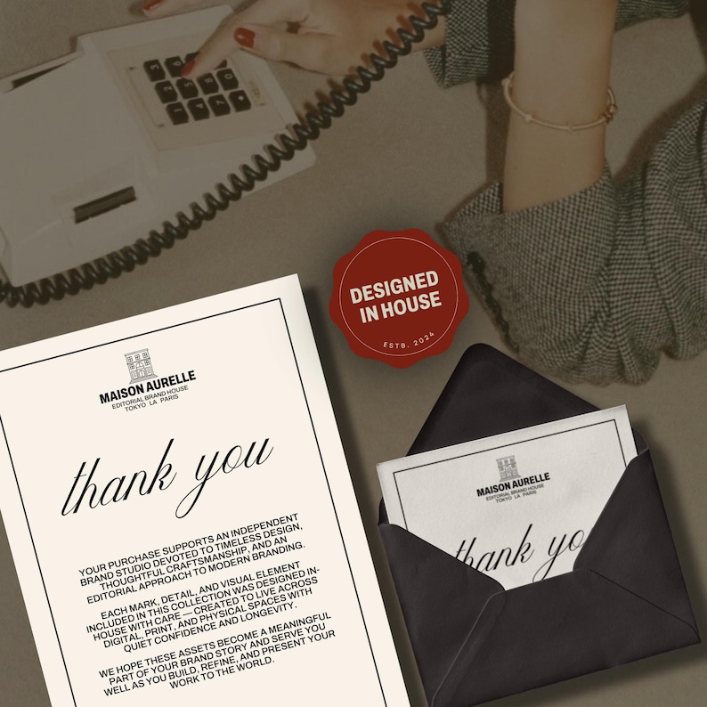 May include: An elegant stationery set featuring a thank you card and envelope, with the Maison Aurelle logo. The card and envelope are black and white, with the words "thank you" in a stylish font. A red "Designed in House" seal is also visible.
