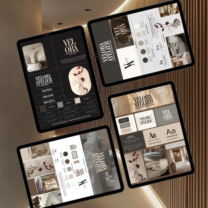 May include: Four tablets displaying design concepts and branding elements. Each tablet features the "VELORA ATELIER" logo, color palettes, and design mockups. The color scheme includes neutral tones with accents of red. The overall aesthetic is modern and minimalist.