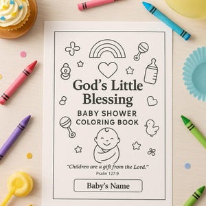 May include: A baby shower coloring book with the text "God's Little Blessing" and "Baby Shower Coloring Book". The book features illustrations of a rainbow, stars, and baby-related items. Crayons in various colors surround the book.