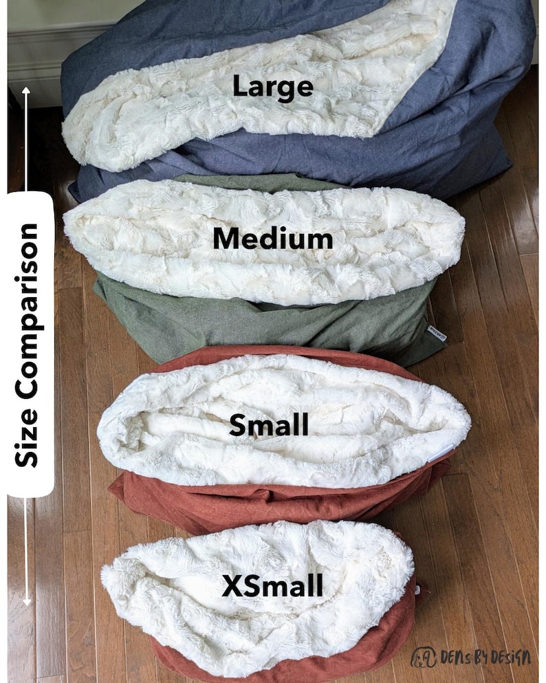 May include: A size comparison of four pet beds: Large, Medium, Small, and XSmall. Each bed has a plush, cream-colored interior and a different colored exterior: blue, green, rust, and a darker rust. The text "Size Comparison" is on the left.