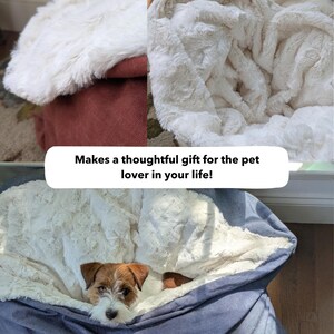 May include: A plush, cream-colored pet bed with a soft, faux fur blanket. The bed is a large size, with a blue denim exterior. A small dog is nestled inside. Text reads: "Makes a thoughtful gift for the pet lover in your life!"