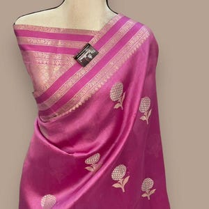 Banarasi soft silk saree with Rich golden zari weaving floral buta design and elegant pallu ideal for wedding and festive wear