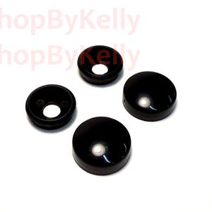 May include: Four black, circular, dome-shaped covers with a smooth, glossy finish. Two of the covers feature a central circular opening, while the other two are solid, closed domes. The text 3DShopByKelly is visible in the upper left corner.
