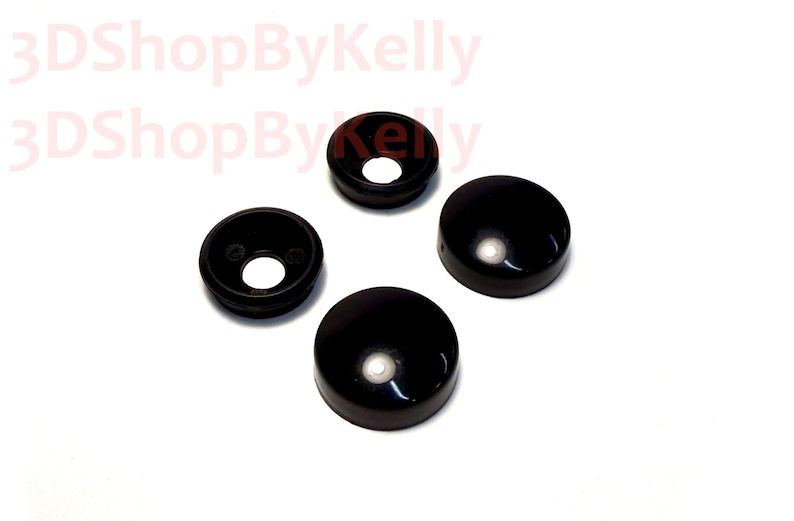 May include: Four black, circular, dome-shaped covers with a smooth, glossy finish. Two of the covers feature a central circular opening, while the other two are solid, closed domes. The text 3DShopByKelly is visible in the upper left corner.