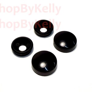 May include: Four black, circular, dome-shaped covers with a smooth, glossy finish. Two of the covers feature a central circular opening, while the other two are solid, closed domes. The text 3DShopByKelly is visible in the upper left corner.